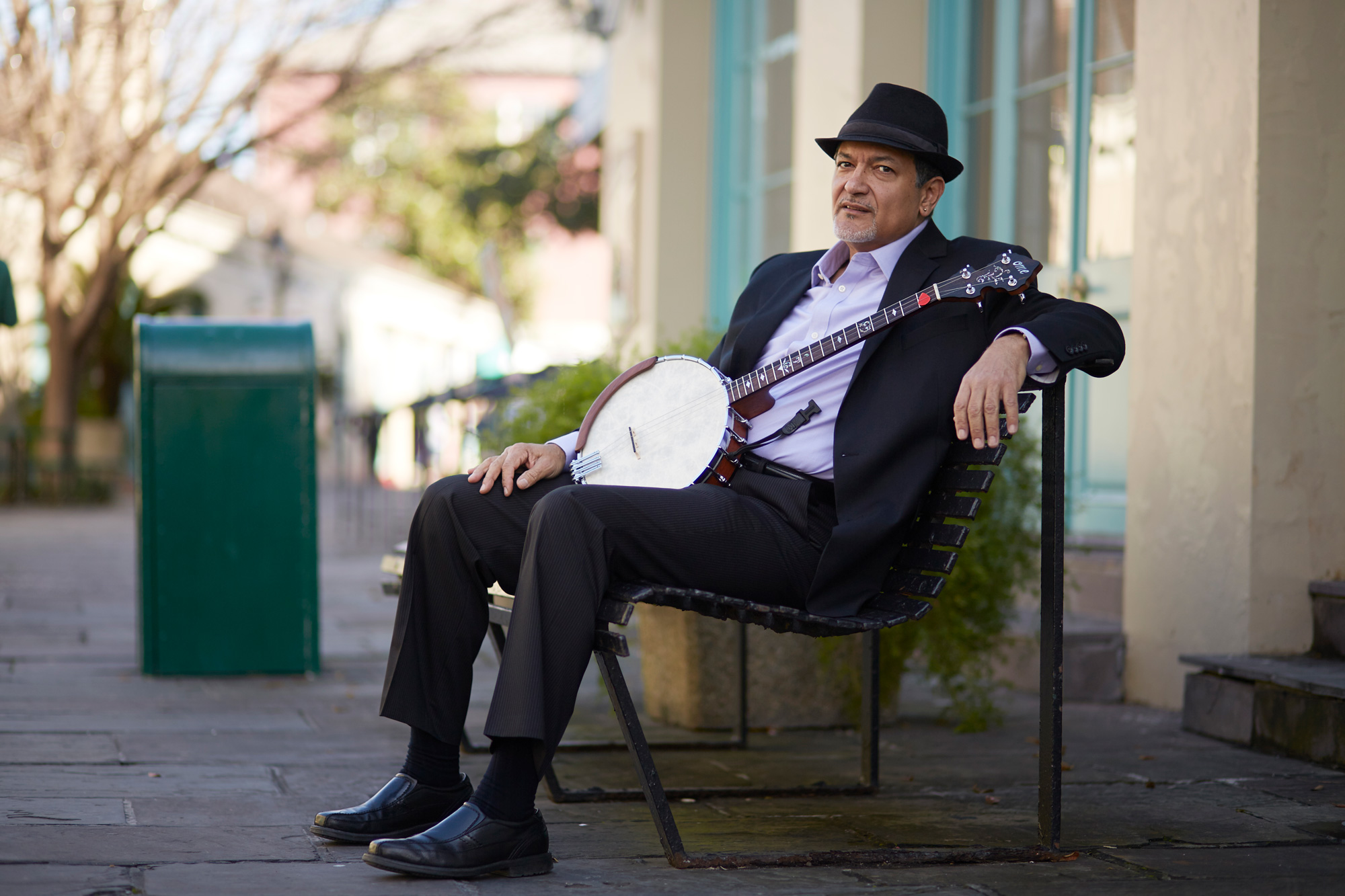 Don Vappie sitting with a banjo